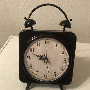 Cute clock with the look of an old alarm clock with bells on top.